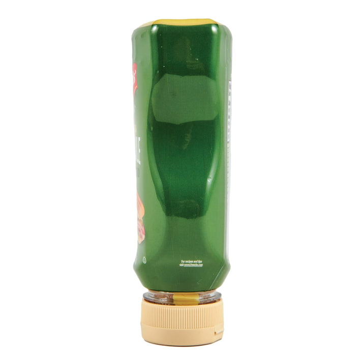 ["A green plastic bottle of French's Mustard with a yellow cap."]