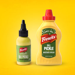 Two bottles of French's Dill Pickle Mustard Spread, a large Frenchs Dill Pickle Sandwich Spread Regular Inverted Squeeze Bottle Rp 12 Oz and a smaller travel-size bottle, are shown side-by-side against a yellow background.