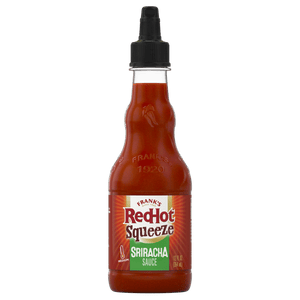 ["A bottle of Frank's RedHot Sriracha Squeeze sauce."]