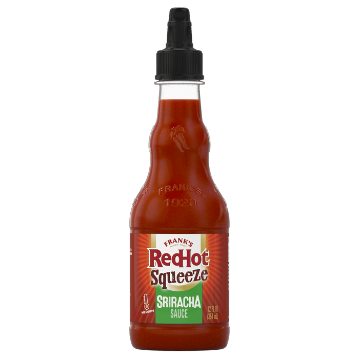 ["A bottle of Frank's RedHot Sriracha Squeeze sauce."]