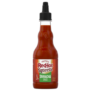["A bottle of Frank's RedHot Sriracha Squeeze sauce."]
