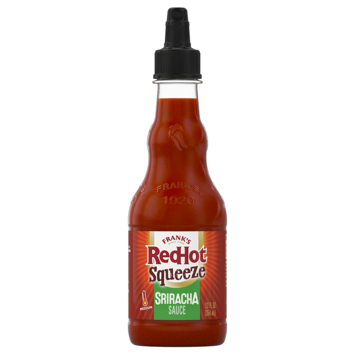 ["A bottle of Frank's RedHot Sriracha Squeeze sauce."]