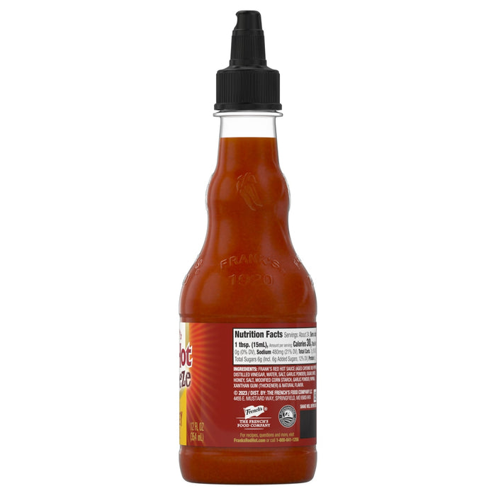 ["A bottle of Frank's RedHot Squeeze sauce with the nutrition facts and ingredients label visible."]