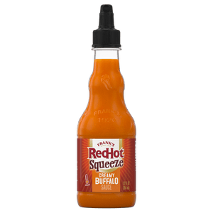 ["A bottle of Frank's RedHot Squeeze Creamy Buffalo Sauce."]