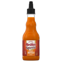 ["A bottle of Frank's RedHot Squeeze Creamy Buffalo Sauce."]