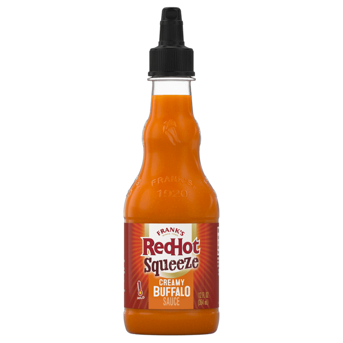["A bottle of Frank's RedHot Squeeze Creamy Buffalo Sauce."]