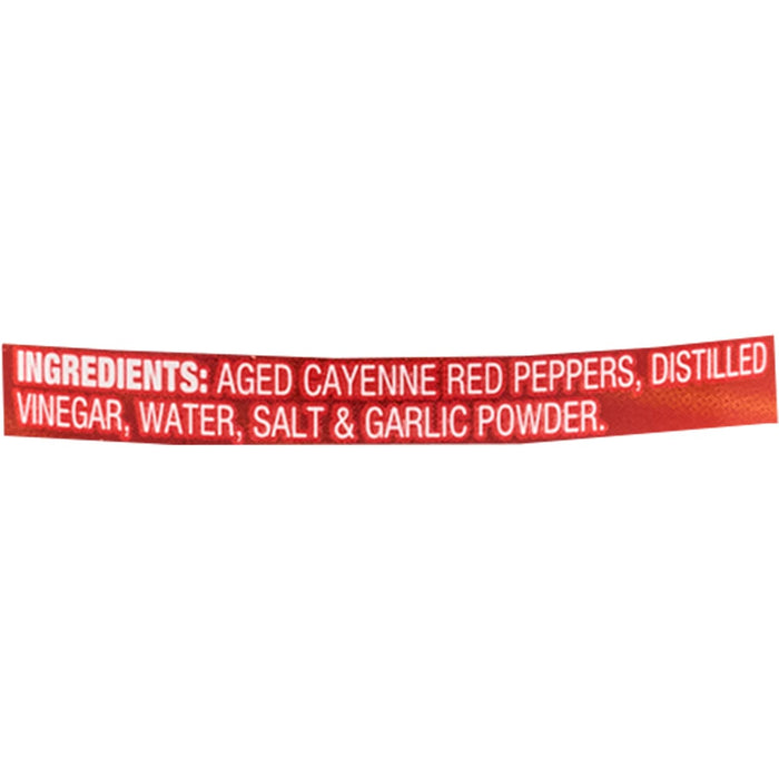 ['A red label with the ingredients for a hot sauce.']