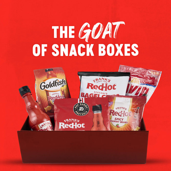 A snack box featuring Goldfish crackers and Frank's RedHot sauce products, marketed as the GOAT of snack boxes.