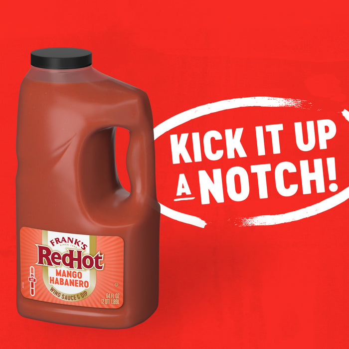 A large jug of Franks Red Hot Mango Habanero Wing Hot Sauce Regular 64 Oz is displayed against a vibrant red background with the bold white text Kick It Up A Notch inside a brushstroke circle.