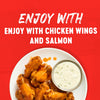 A plate of glazed chicken wings served with a side of blue cheese dressing illustrates how to enjoy Franks Red Hot Mango Habanero Wing Hot Sauce Regular 64 Oz with chicken wings and salmon.