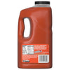 A large, clear jug of Franks Red Hot Mango Habanero Wing Hot Sauce Regular 64 Oz is shown, with the label detailing the nutritional information, ingredients, and serving suggestions.