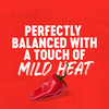 A red pepper on a red background with the text Perfectly balanced with a touch of mild heat.