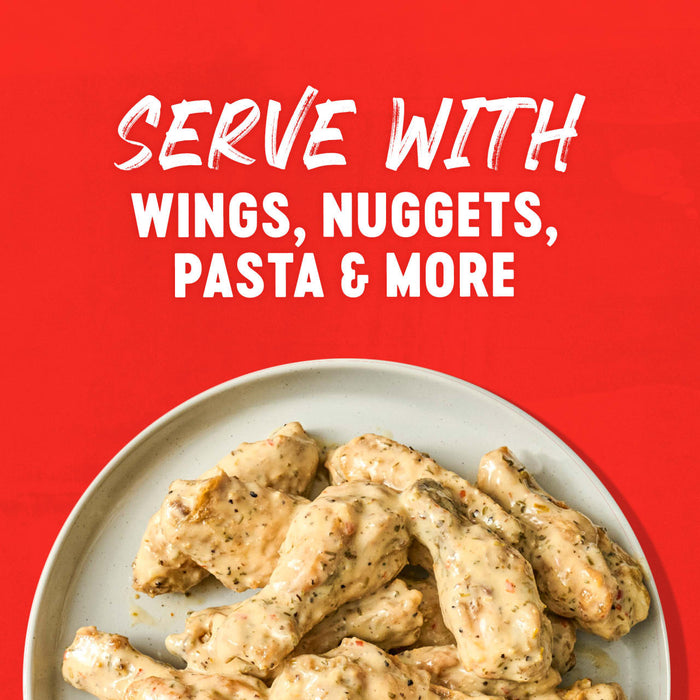 A plate of chicken wings with a creamy sauce, suggesting it can be served with wings, nuggets, pasta, and more.