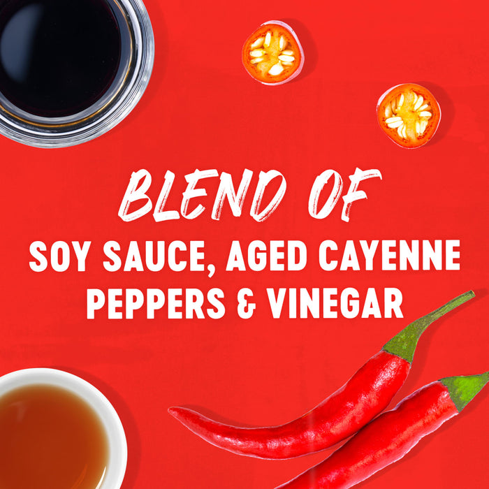 This image showcases the ingredients of a blend of soy sauce aged cayenne peppers and vinegar with a red background.