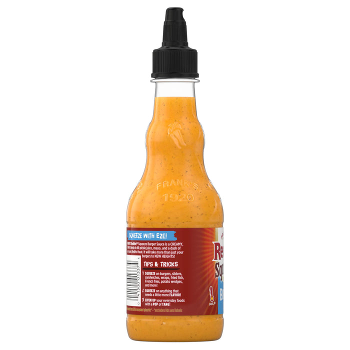 A bottle of Franks RedHot Squeeze Burger Sauce with a black squeeze top showcasing the products label and creamy tangy sauce.