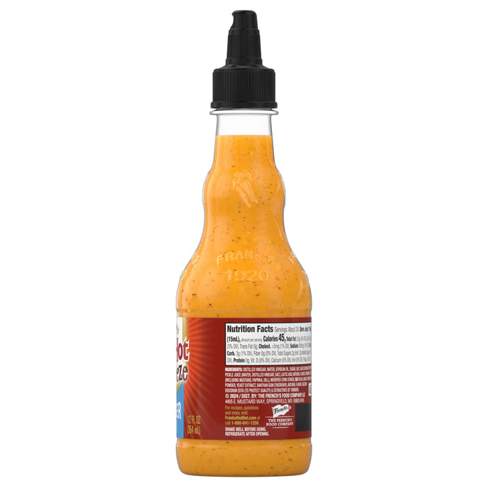 A bottle of Franks RedHot Buffalo Ranch a creamy sauce with visible spices.