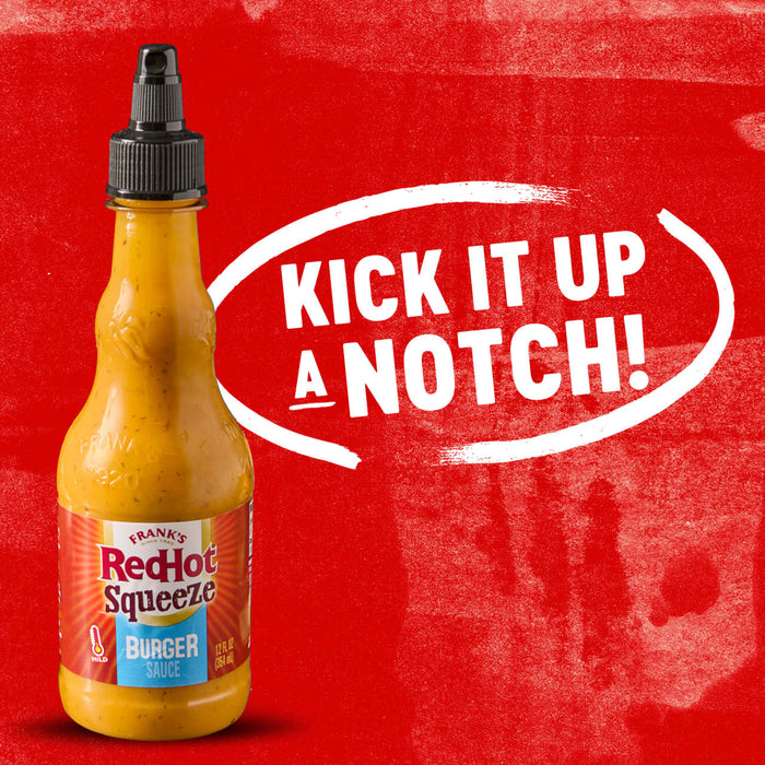 A bottle of Franks RedHot Squeeze Burger Sauce with the text Kick it up a notch! in a white circle.