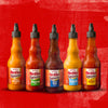 Six bottles of Franks RedHot Squeeze sauce in different flavors.