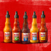 Six bottles of Franks RedHot Squeeze sauce in different flavors.