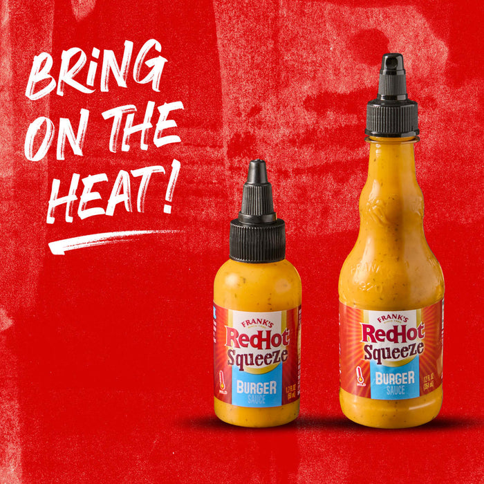 Two bottles of Frank\s RedHot Squeeze Burger Sauce on a red background with the text Bring on the Heat!