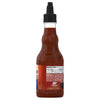 A bottle of Franks Hot Sauce with its nutrition facts and ingredients label visible.