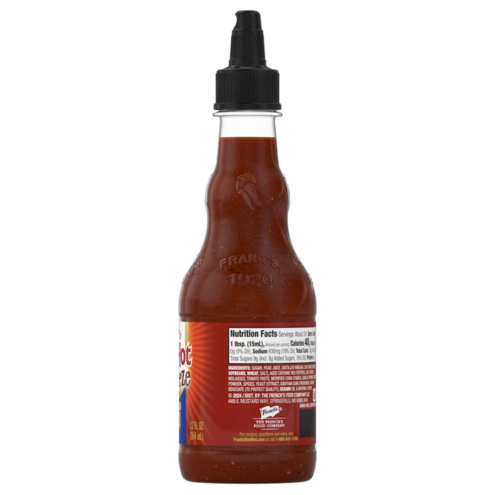 A bottle of Franks Hot Sauce with its nutrition facts and ingredients label visible.
