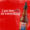 A bottle of Frank\s RedHot Squeeze Korean BBQ Sauce on a red background with the text I put that on everything.