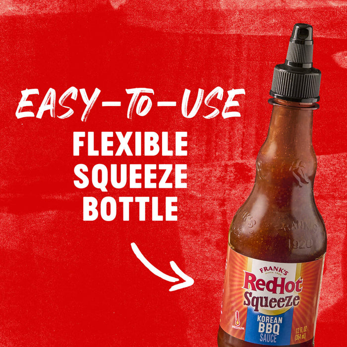 A bottle of Frank\s RedHot Squeeze Korean BBQ Sauce with a red background and white text that says Easy-to-use Flexible Squeeze Bottle.