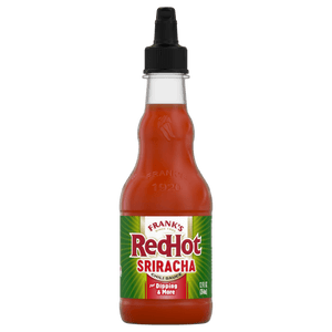 A bottle of Franks RedHot Sriracha chili sauce.