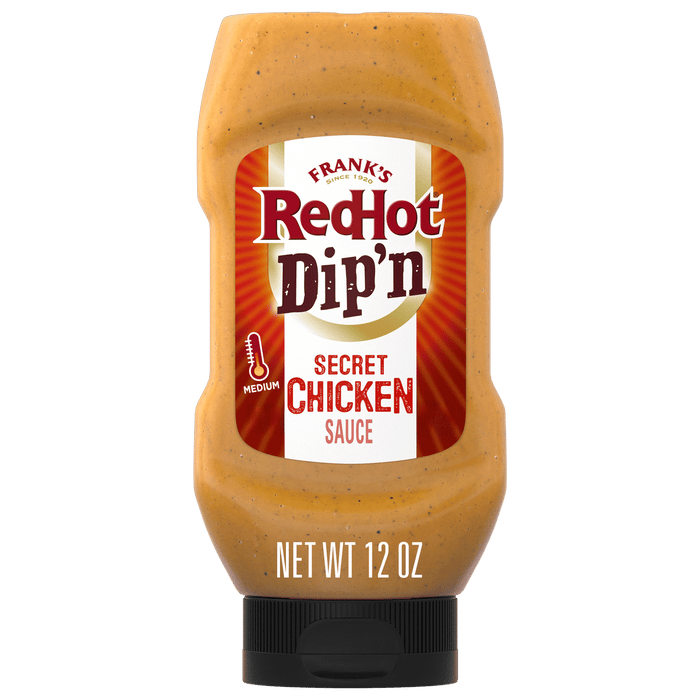 A bottle of Franks RedHot Dipn Secret Chicken Sauce.