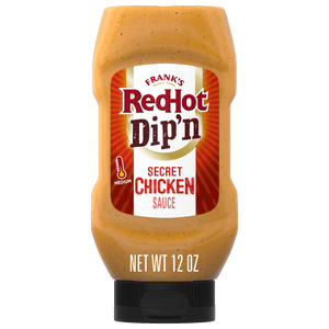 A bottle of Franks RedHot Dipn Secret Chicken Sauce.