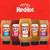 Franks RedHot Dipn sauces in Buffalo Ranch Sweet n Sour Secret Chicken Sweet &amp; Tangy Golden and Roasted Garlic flavors are displayed against a red background.