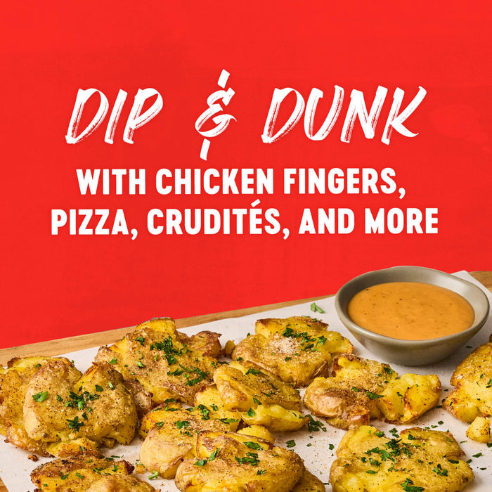 A plate of smashed potatoes with a dipping sauce perfect for dipping and dunking with chicken fingers pizza cruditACs and more.