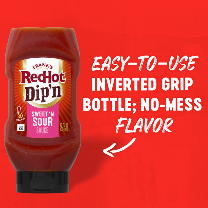 A bottle of Franks RedHot Dipn Sweet n Sour Sauce is displayed against a red background highlighting its easy-to-use inverted grip bottle and no-mess flavor.