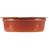 A small, sealed container of sauce or condiment.