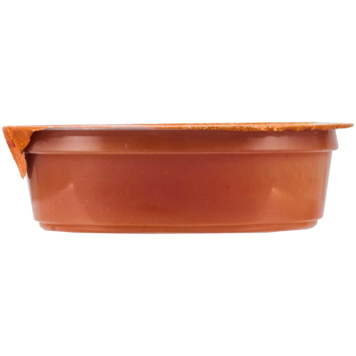 A sealed container of what appears to be a food product, possibly a dip or sauce.