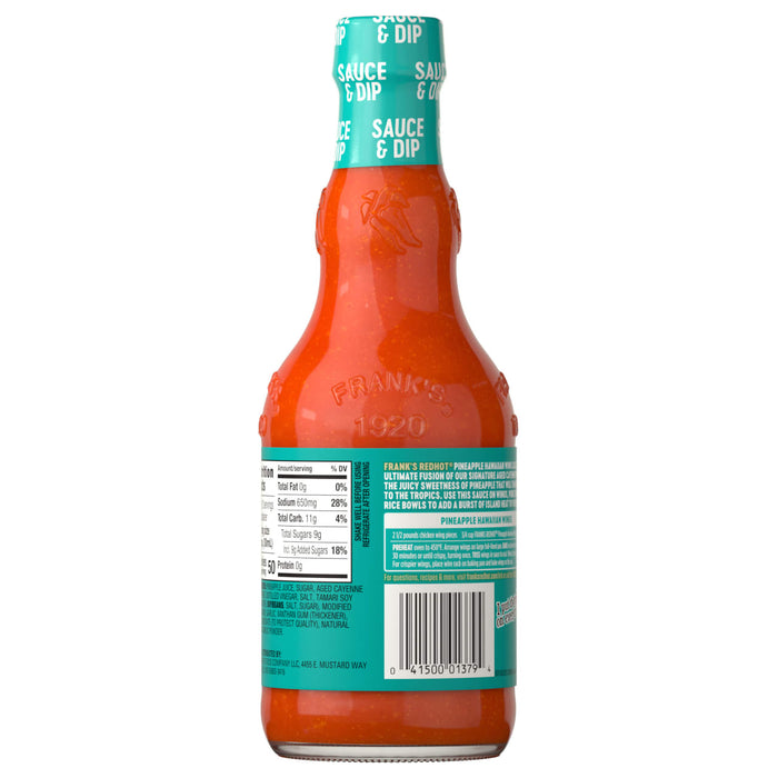 A bottle of LA's Totally Awesome Sauce is displayed, showcasing its vibrant color and branding.