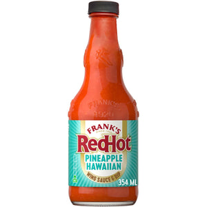 A bottle of Frank's RedHot Pineapple Hawaiian hot sauce.