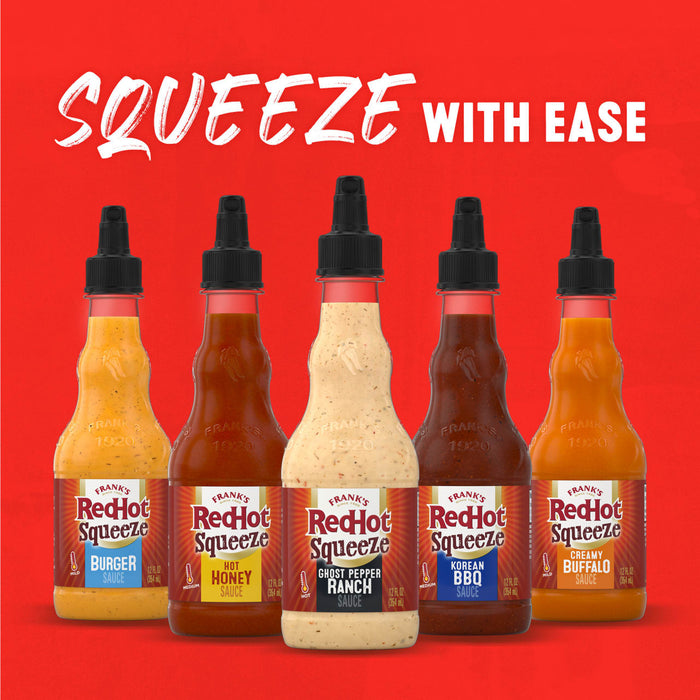 A variety of Frank's RedHot squeeze bottles are displayed against a red background, promoting the ease of use with the text Squeeze with Ease.