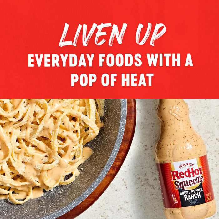 A plate of pasta with a creamy sauce and a bottle of Frank's RedHot Sriracha sauce, promoting the idea of adding a pop of heat to everyday foods.