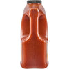 A large container of tomato juice with a handle for easy pouring.