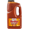 A jug of Frank's RedHot Wings Spicy Maple Sauce is displayed.