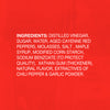Ingredients list for a hot sauce, including distilled vinegar, sugar, aged cayenne red peppers, and garlic powder.