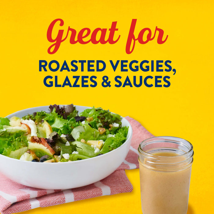This image promotes a product that is great for roasted veggies, glazes, and sauces, featuring a salad and a jar of the product on a pink and white towel against a yellow background.