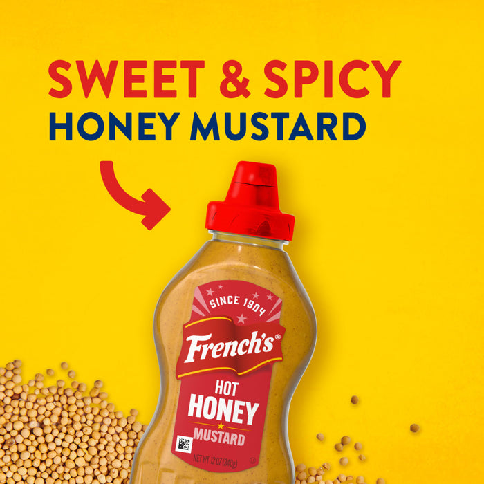 Frank's Sweet &amp; Spicy Honey Mustard bottle on a yellow background with mustard seeds.