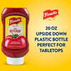 A 20 oz upside down plastic bottle of FrenchS Tomato Ketchup, 20 Oz is displayed against a bright yellow background with text highlighting its tabletop convenience.