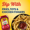 A bottle of French S Tomato Ketchup, 20 Oz is shown next to a bowl of seasoned french fries with a small dipping cup of ketchup against a bright yellow background.