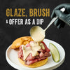 A gloved hand ladles creamy Cattlemen'S Alabama White Bbq Sauce, 0.5 Gal over a roast beef sandwich on a white plate, with the words Glaze, Brush &amp; Dip highlighting the sauce's versatility.