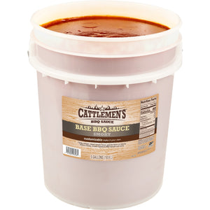 ["A 5-gallon bucket of Cattlemen's Smoky Base BBQ Sauce."]