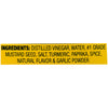 ['A yellow label with the ingredients for a mustard product.']